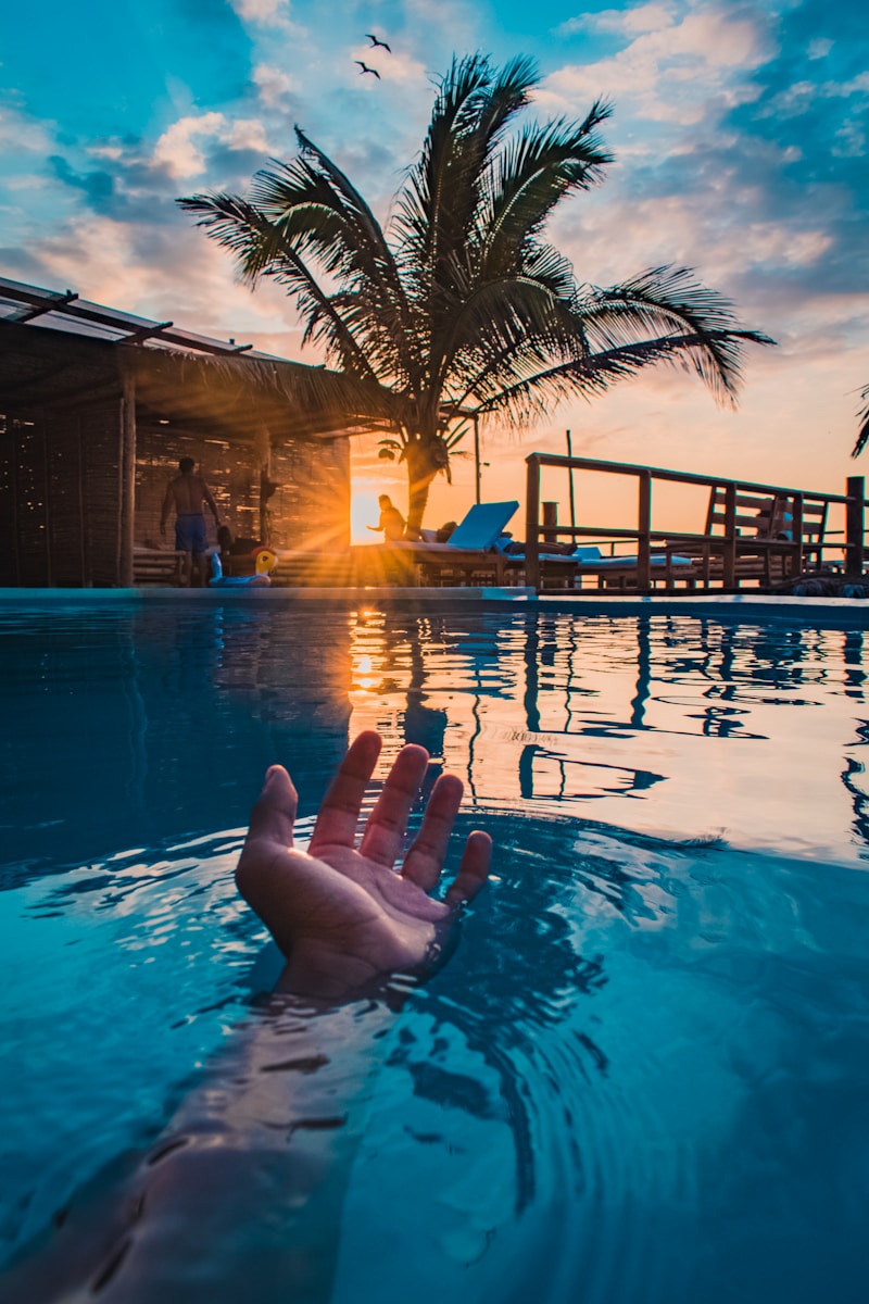 person lying on swimming pool during night time